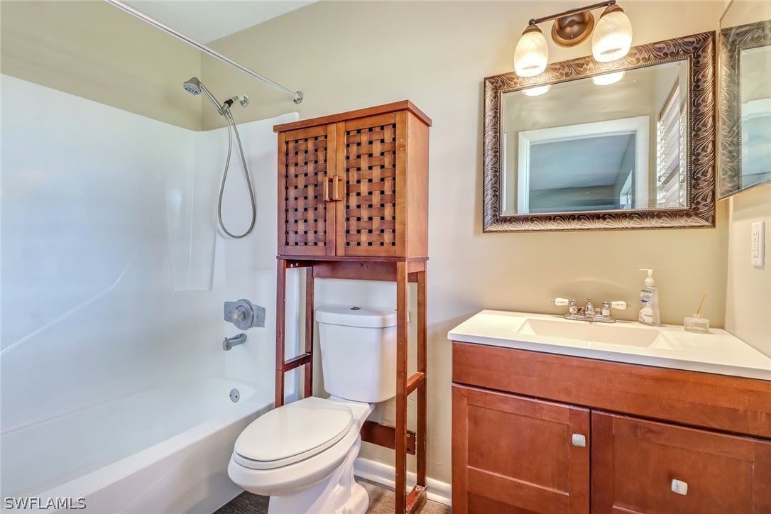 5381 Jackson Road Fort Myers, FL 33905 - Photo 11 of 23 a bathroom with a sink a toilet and shower