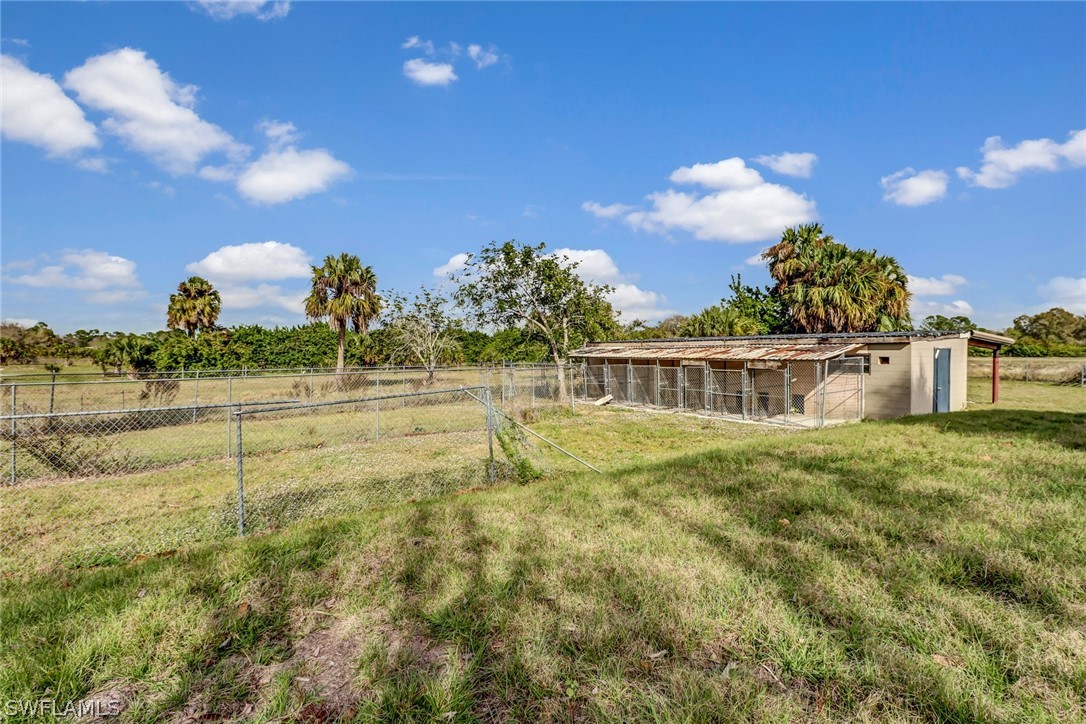 5381 Jackson Road Fort Myers, FL 33905 - Photo 17 of 23 a view of a big yard with a fountain
