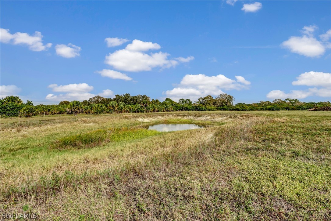 5381 Jackson Road Fort Myers, FL 33905 - Photo 19 of 23 a view of a lake with houses in the back