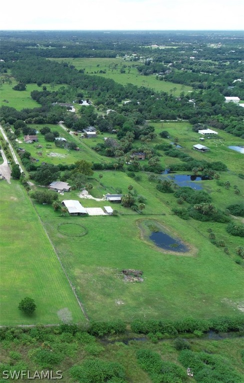 5381 Jackson Road Fort Myers, FL 33905 - Photo 23 of 23 a view of a grassy field with trees