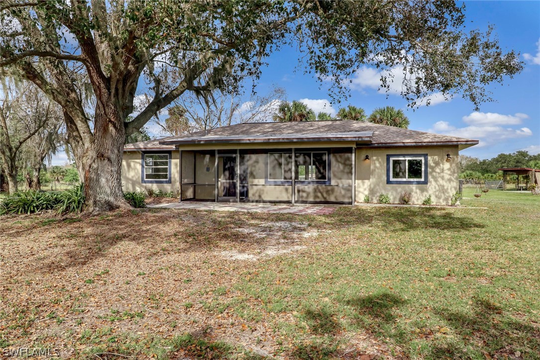 5381 Jackson Road Fort Myers, FL 33905 - Photo 4 of 23 a front view of a house with garden