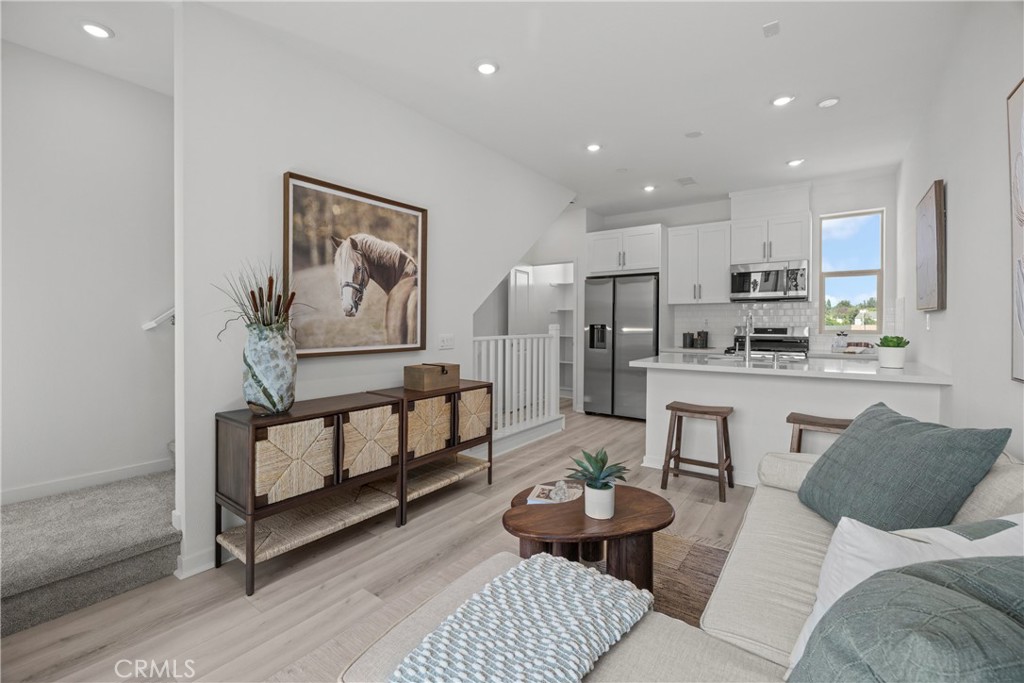 a living room with furniture and a painting