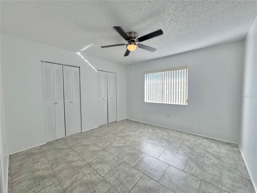 292 Winter Ridge Boulevard, Unit 292 Winter Haven, FL 33881 - Photo 12 of 37 a view of an empty room with a window