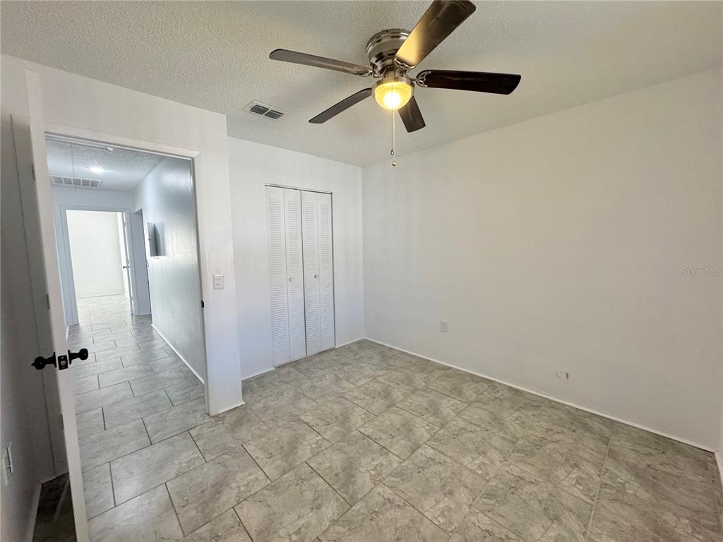 292 Winter Ridge Boulevard, Unit 292 Winter Haven, FL 33881 - Photo 15 of 37 an empty room with fan