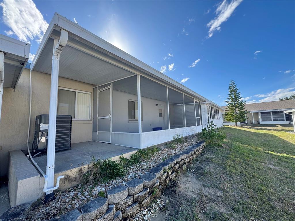 292 Winter Ridge Boulevard, Unit 292 Winter Haven, FL 33881 - Photo 23 of 37 a view of a house with backyard and garden