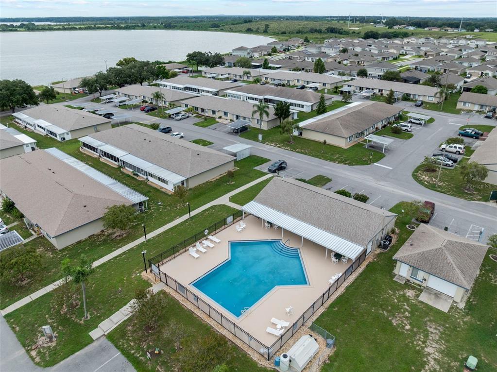 292 Winter Ridge Boulevard, Unit 292 Winter Haven, FL 33881 - Photo 24 of 37 an aerial view of residential houses with outdoor space and ocean view