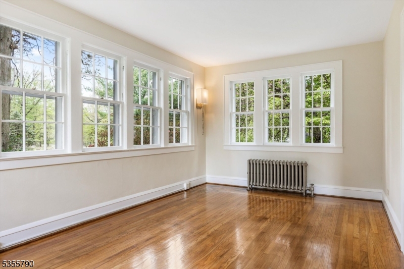 416 Rosemont Ringoes Road Stockton, NJ 08559 - Photo 16 of 39 a view of an empty room with wooden floor and a window