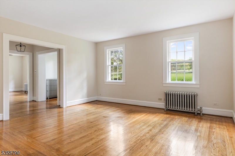 416 Rosemont Ringoes Road Stockton, NJ 08559 - Photo 17 of 39 an empty room with wooden floor and windows