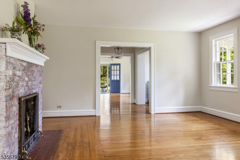 416 Rosemont Ringoes Road Stockton, NJ 08559 - Photo 18 of 39 a view of a livingroom with wooden floor and a fireplace