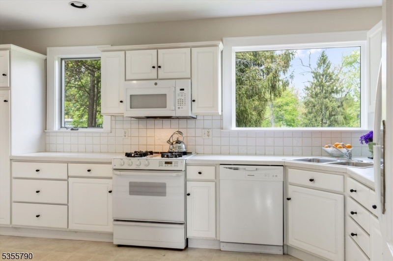416 Rosemont Ringoes Road Stockton, NJ 08559 - Photo 20 of 39 a kitchen with white cabinets and white appliances