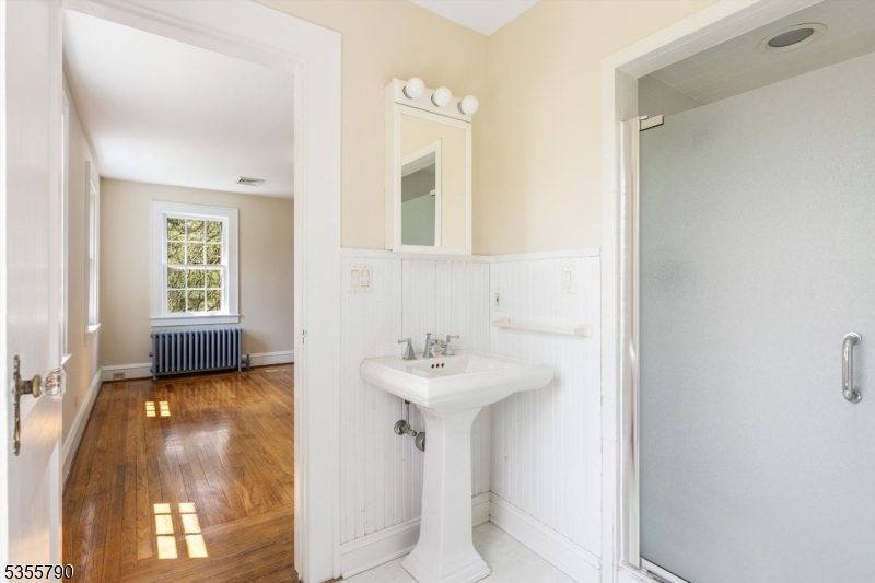 416 Rosemont Ringoes Road Stockton, NJ 08559 - Photo 24 of 39 a bathroom with a sink a mirror and a bathtub