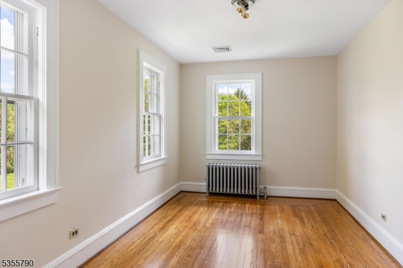 416 Rosemont Ringoes Road Stockton, NJ 08559 - Photo 27 of 39 an empty room with wooden floor and windows