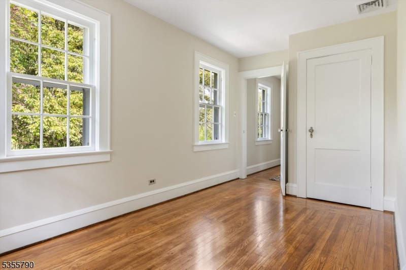 416 Rosemont Ringoes Road Stockton, NJ 08559 - Photo 29 of 39 an empty room with wooden floor and windows