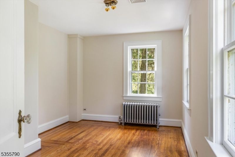 416 Rosemont Ringoes Road Stockton, NJ 08559 - Photo 30 of 39 an empty room with a window and wooden floor