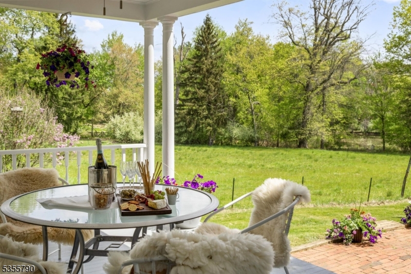 416 Rosemont Ringoes Road Stockton, NJ 08559 - Photo 4 of 39 a view of a dining room with furniture and a potted plant