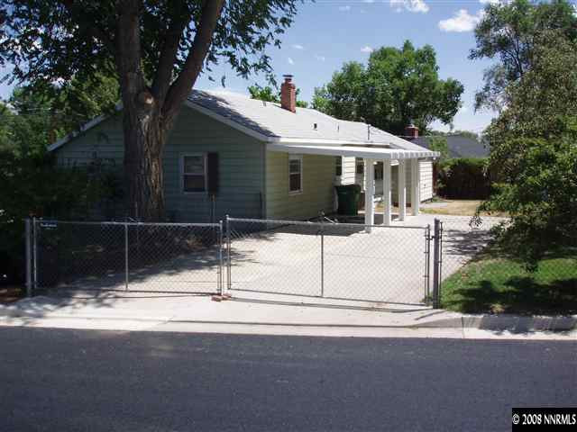 2065 Keystone Avenue Reno, NV 89503 - Photo 1 of 3 a front view of a house with yard and trees