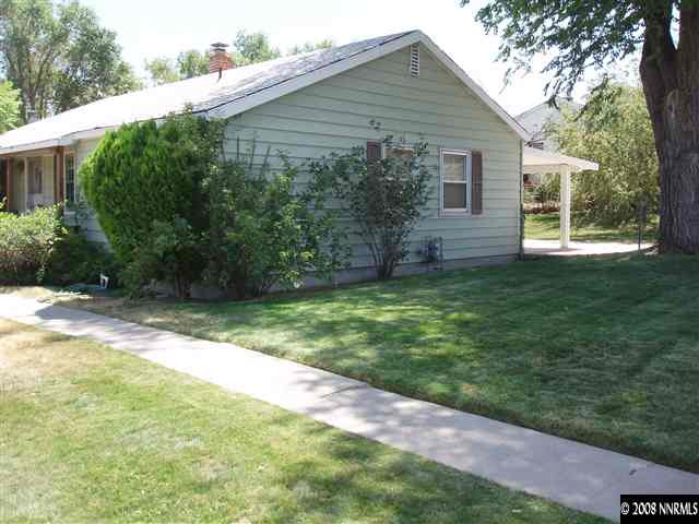 2065 Keystone Avenue Reno, NV 89503 - Photo 3 of 3 a backyard of a house with plants and large tree