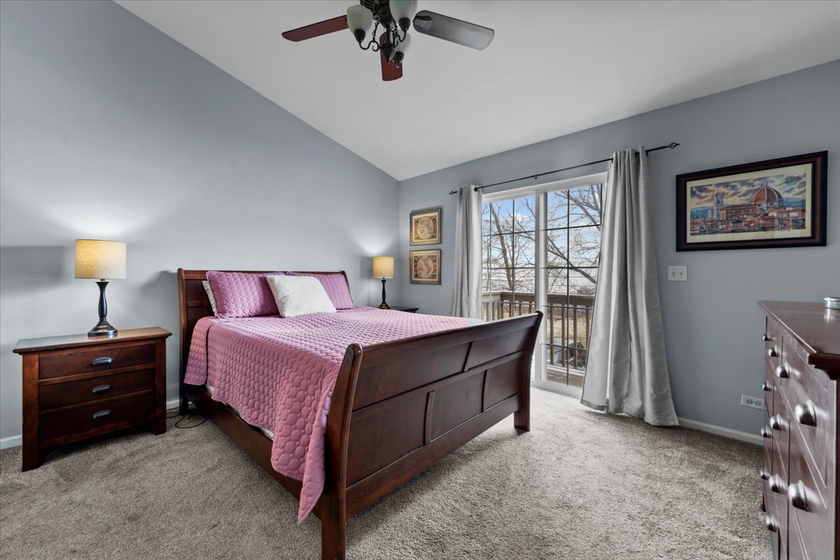 907 Main Street Batavia, IL 60510 - Photo 11 of 20 a bedroom with a bed and a chandelier