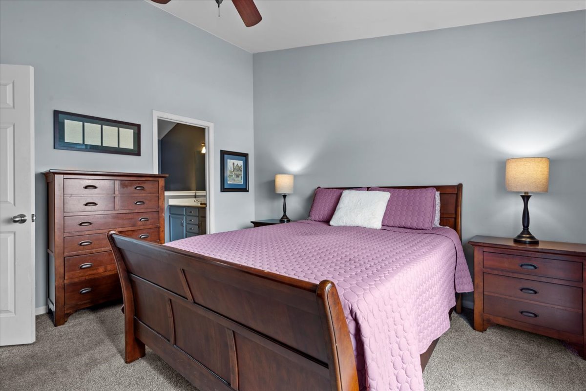 907 Main Street Batavia, IL 60510 - Photo 13 of 20 a bedroom with a bed and a tv on table