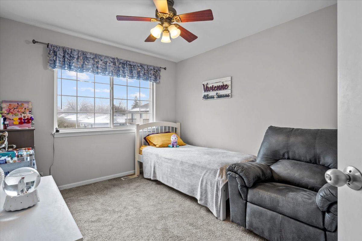 907 Main Street Batavia, IL 60510 - Photo 17 of 20 a bedroom with furniture and a window
