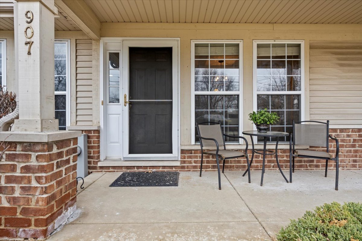 907 Main Street Batavia, IL 60510 - Photo 3 of 20 a view of a patio with table and chairs and potted plants