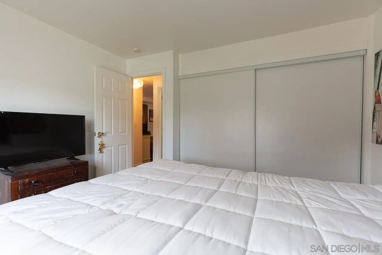 33475 Windmill Road Wildomar, CA 92595 - Photo 17 of 34 a bedroom with a bed and a flat screen tv