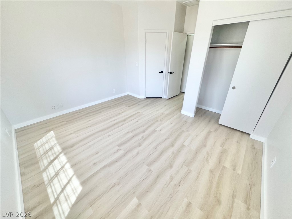 7340 Ridge Star Court Las Vegas, NV 89131 - Photo 12 of 22 Natural light illuminates the durable light-toned flooring in this inviting room with ample closet space.