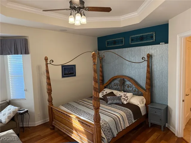 a bedroom with bed and a window