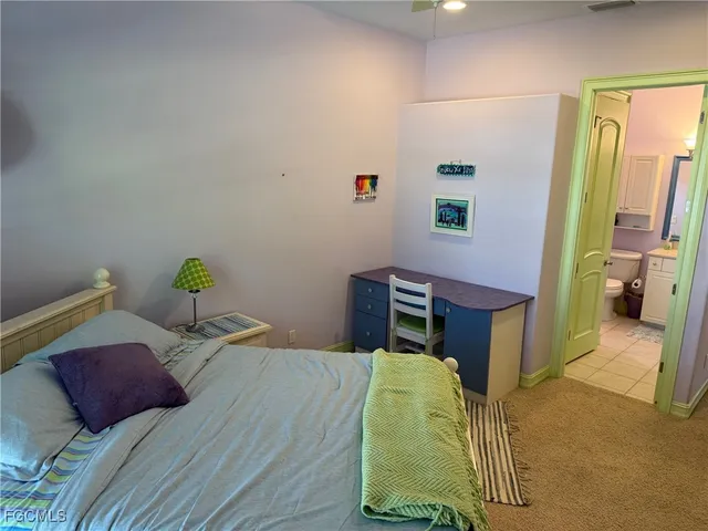 a bedroom with a bed and a closet