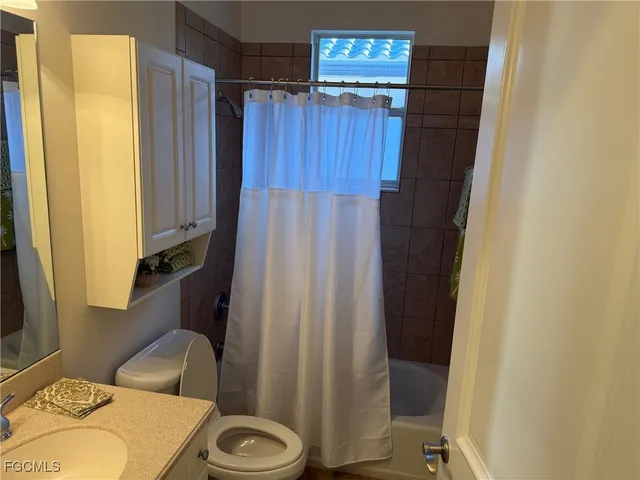 a bathroom with a sink and toilet
