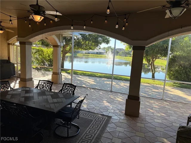 a view of a dining room with furniture wooden floor and chandelier