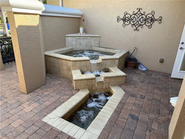 a white bath tub sitting in a bathroom next to a sink