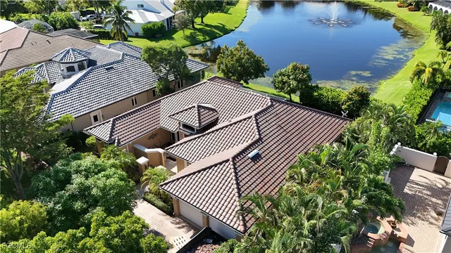 an aerial view of house with garden space and street view