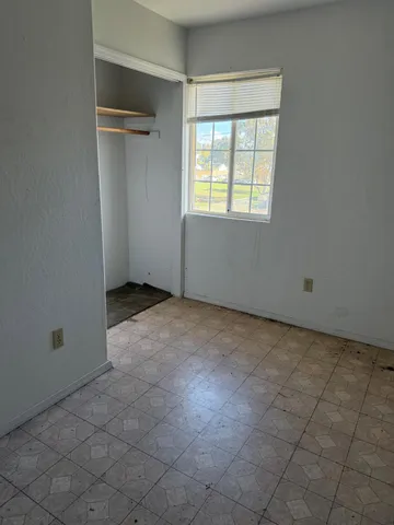 a view of an empty room with a window