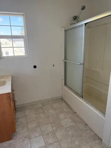 a room with a cabinets and a counter top space
