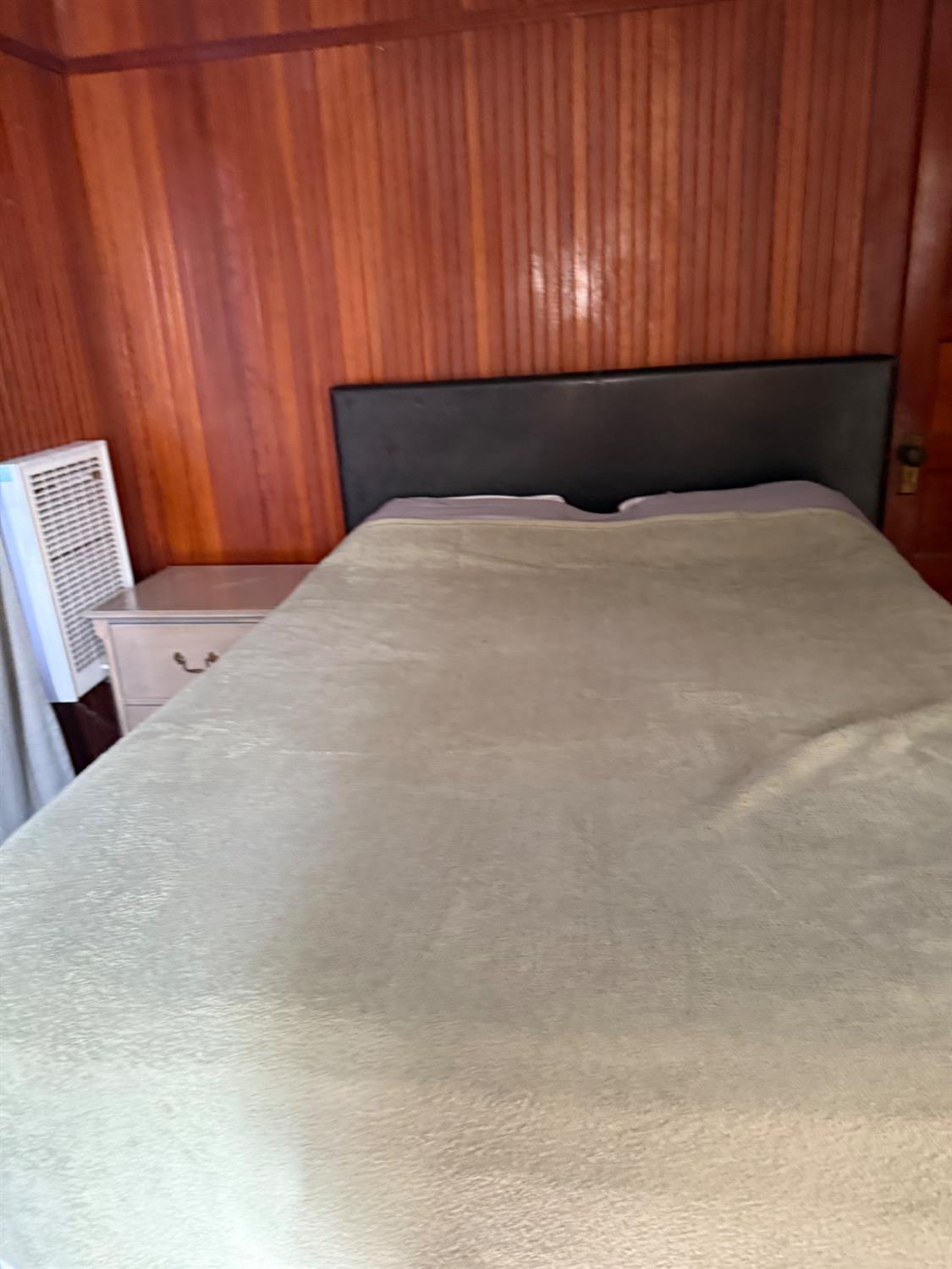 301 B Street Isleton, CA 95641 - Photo 20 of 30 a bedroom with a bed and curtain