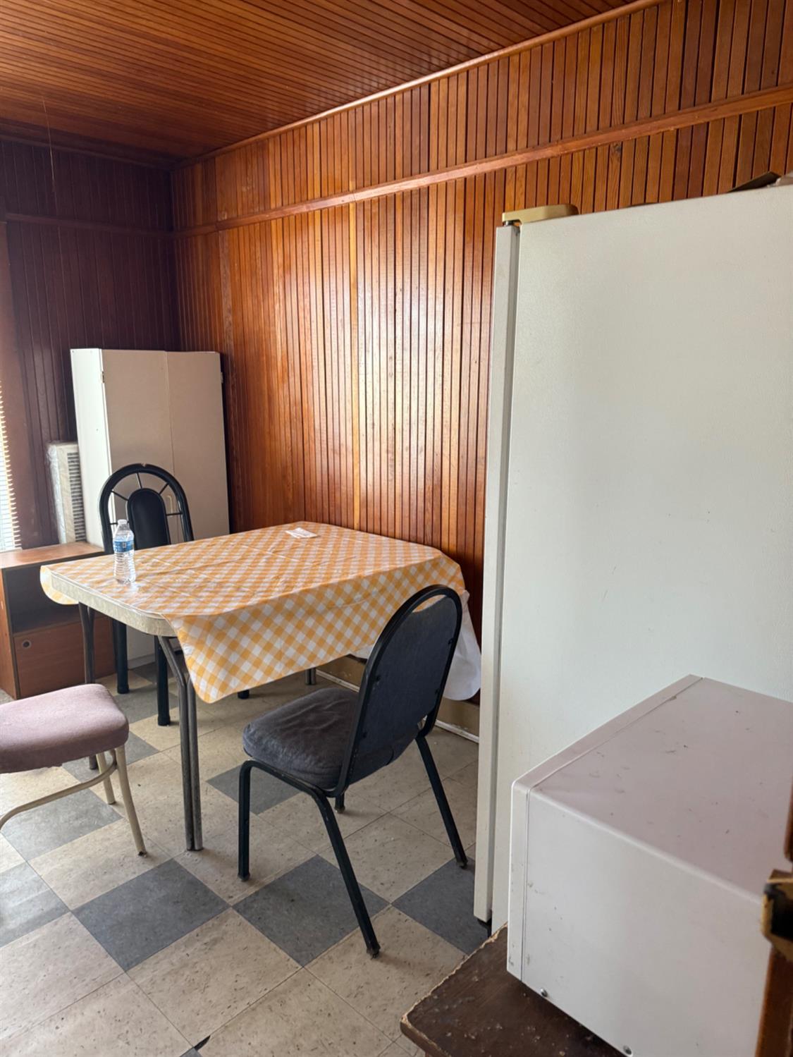 301 B Street Isleton, CA 95641 - Photo 23 of 30 a bedroom with a bed and a chair