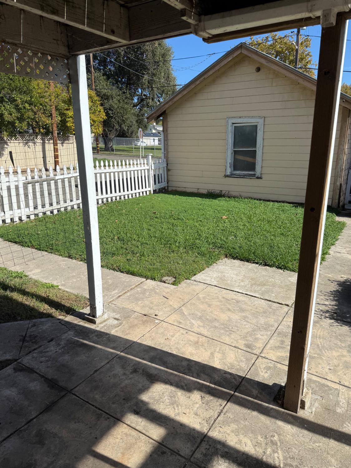 301 B Street Isleton, CA 95641 - Photo 27 of 30 a view of a house with a small yard and wooden fence