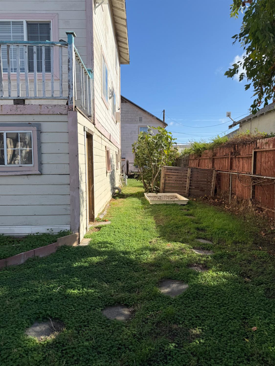 301 B Street Isleton, CA 95641 - Photo 4 of 30 a view of a house with a yard and plants