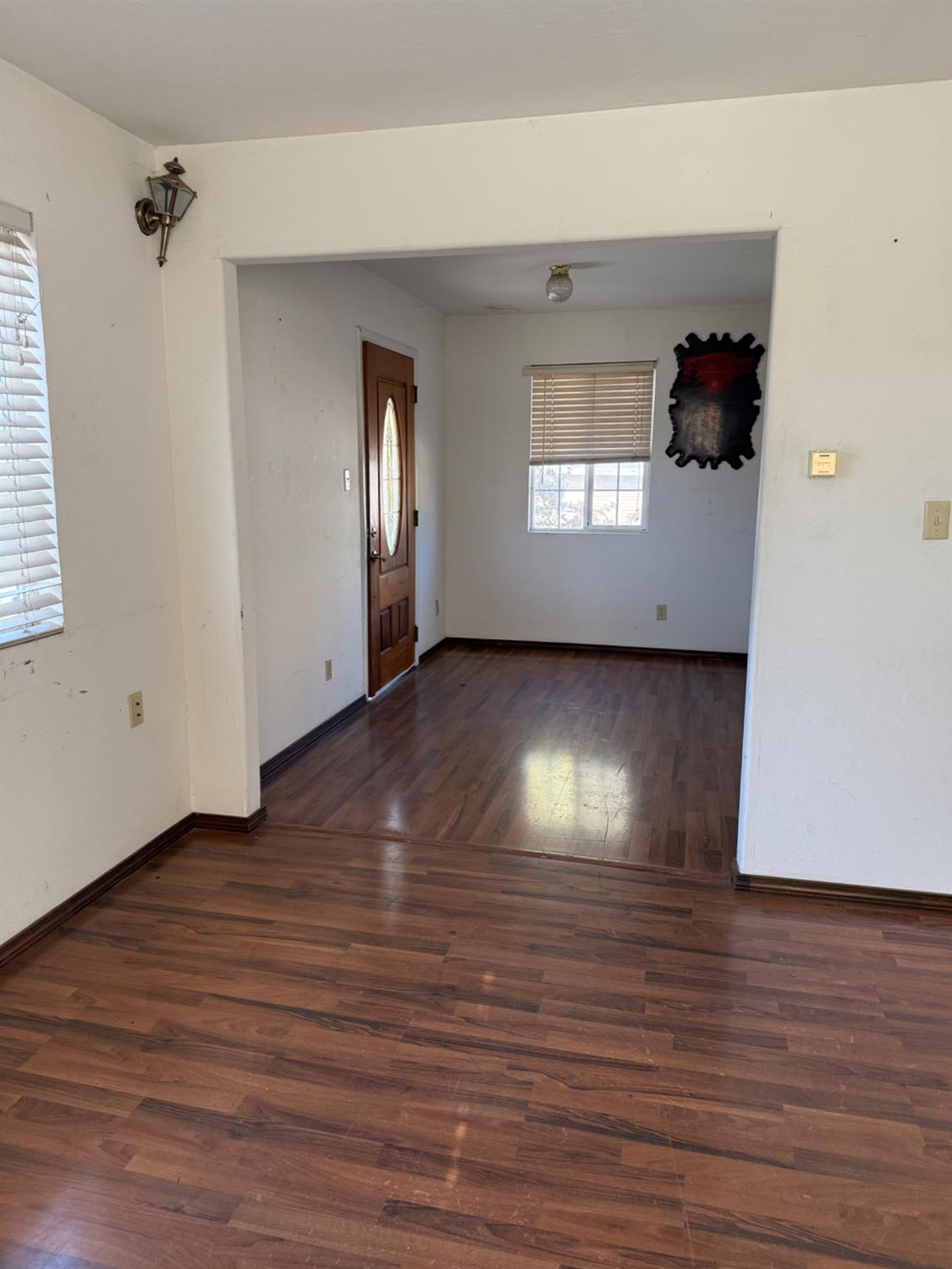 301 B Street Isleton, CA 95641 - Photo 7 of 30 a view of a living room with hardwood floor and a ceiling fan