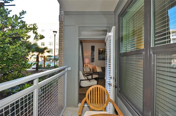 a balcony with view of outdoor space