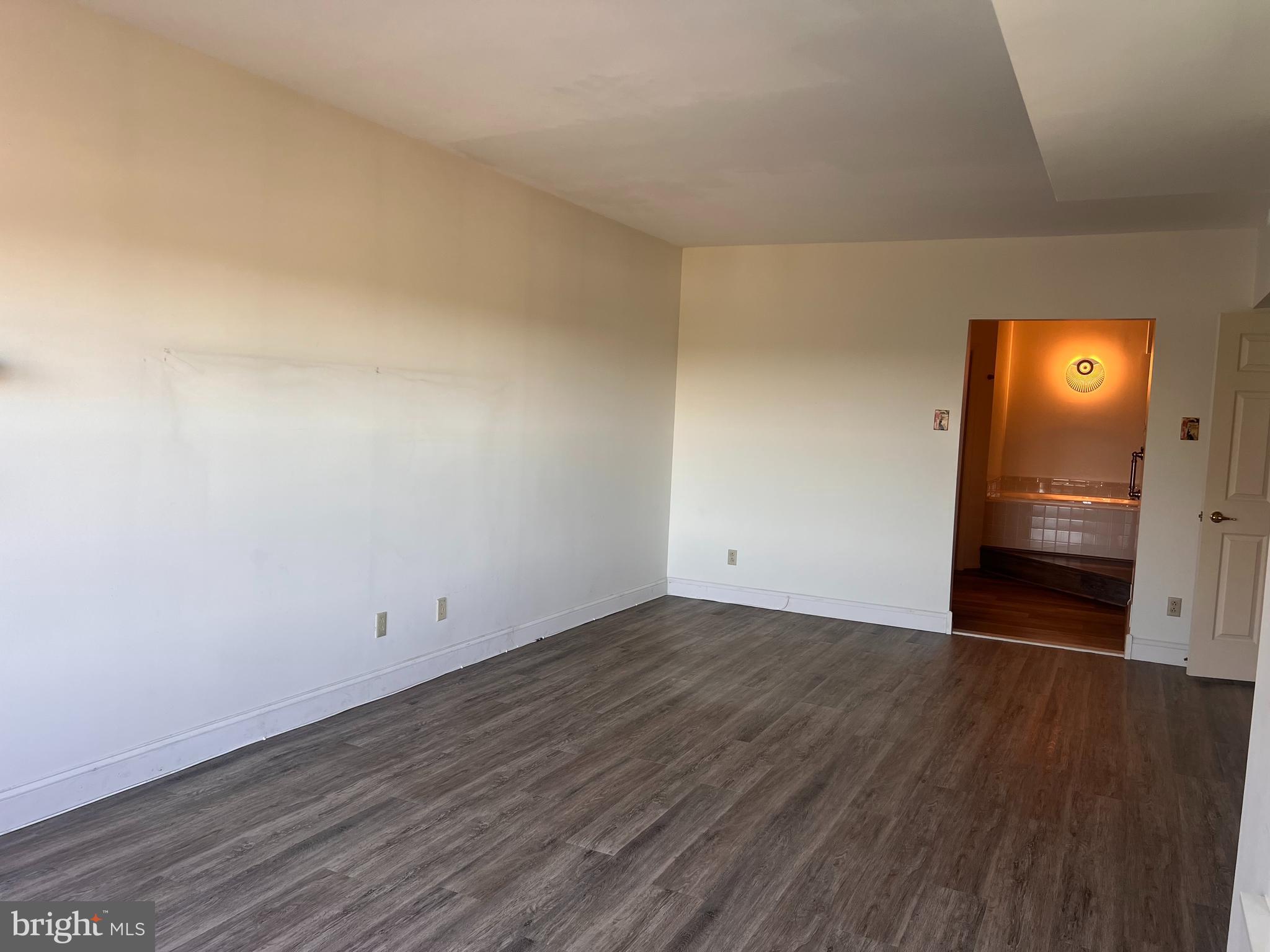 6073 Main Street Voorhees, NJ 08043 - Photo 6 of 16 a view of an empty room and wooden floor