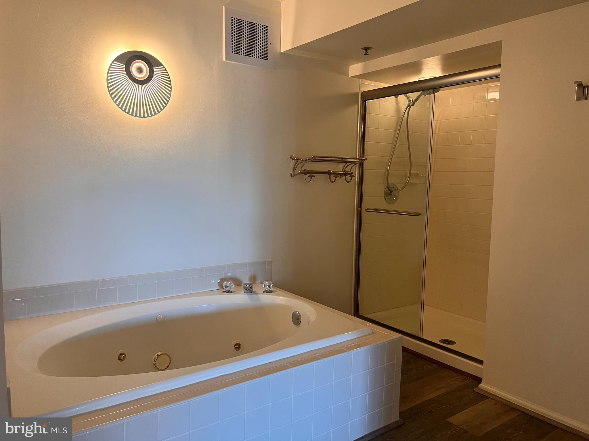 6073 Main Street Voorhees, NJ 08043 - Photo 9 of 16 a bathroom with a tub and a shower