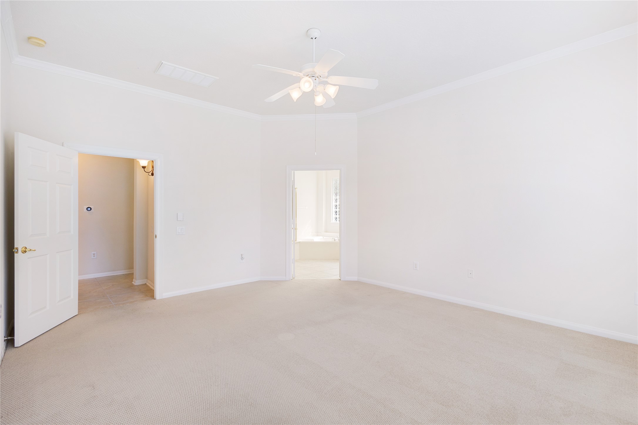 43 Tarrytown Way Conroe, TX 77384 - Photo 23 of 41 a view of an empty room with a chandelier fan