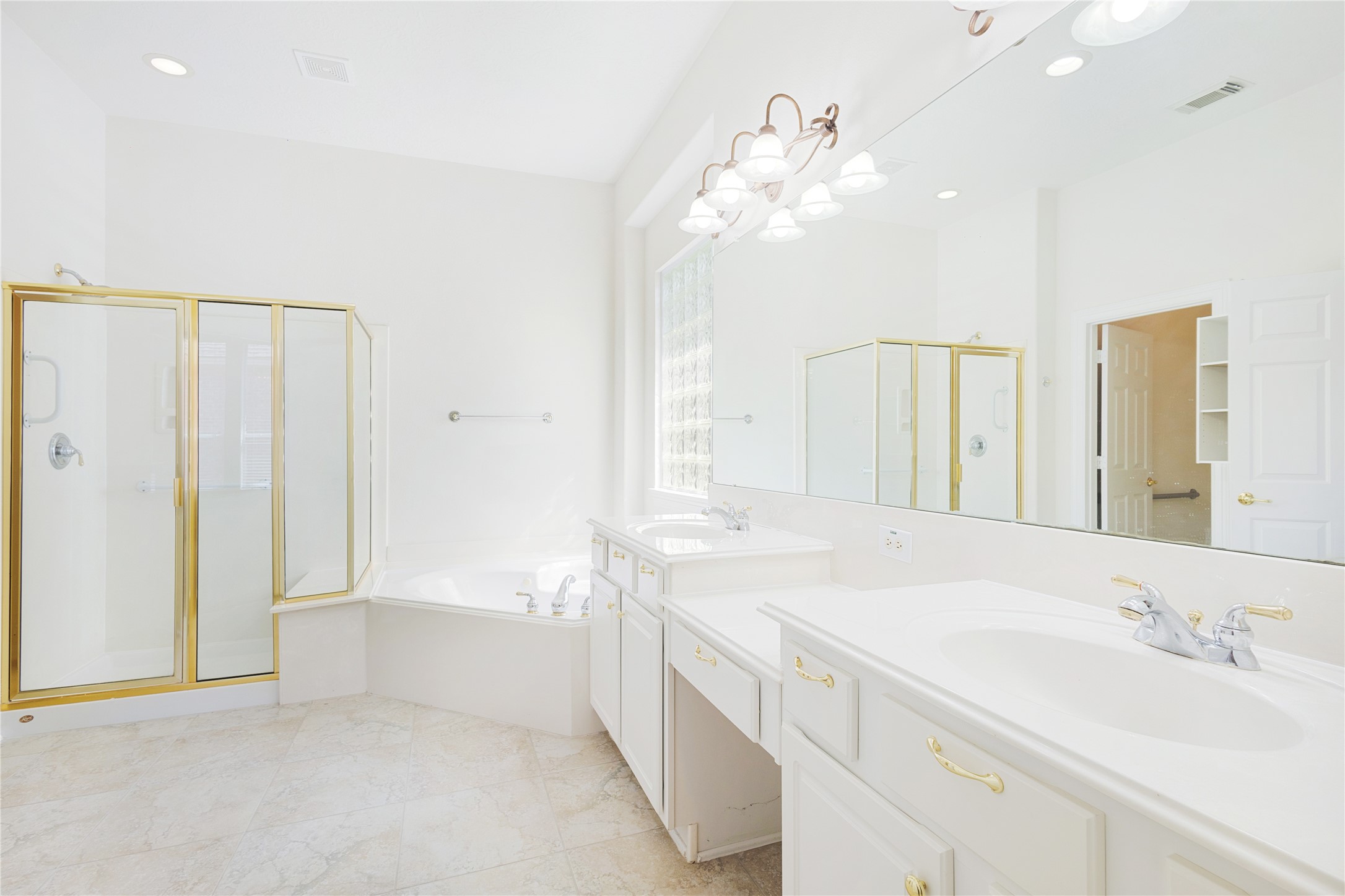 43 Tarrytown Way Conroe, TX 77384 - Photo 25 of 41 a bathroom with a sink a vanity and a mirror