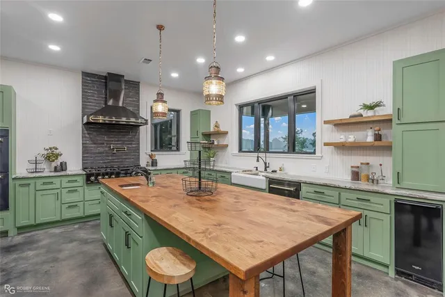 a kitchen with a sink and a large window