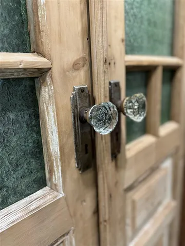 a spacious bedroom with a large bed and a window