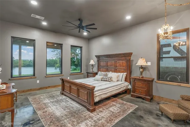 a bathroom with a granite countertop sink and mirror