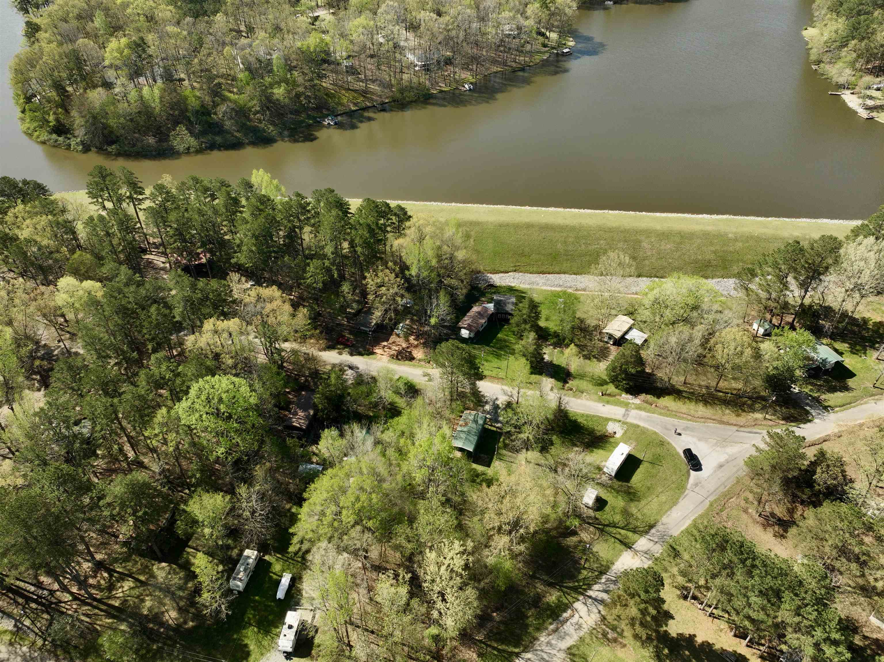 54 Campfire Cove, Unit C54 Middleton, TN 38052 - Photo 11 of 15 a view of a lake with a yard