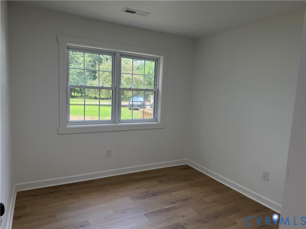 8207 Sebera Road Prince George, VA 23875 - Photo 21 of 27 Bright secondary bedroom featuring expansive windo